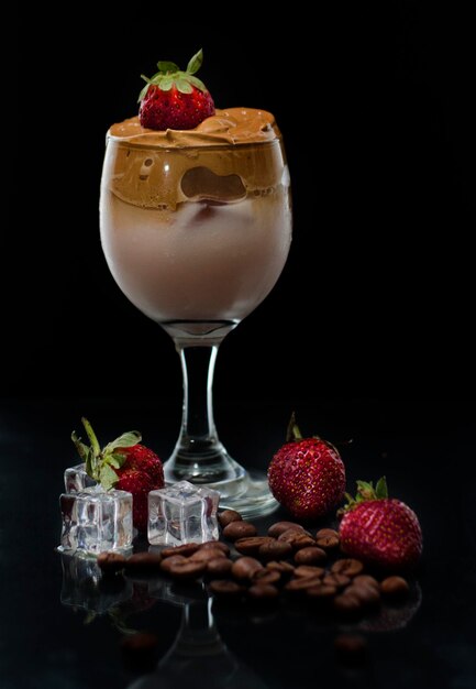 close-up of strawberries on table against black background