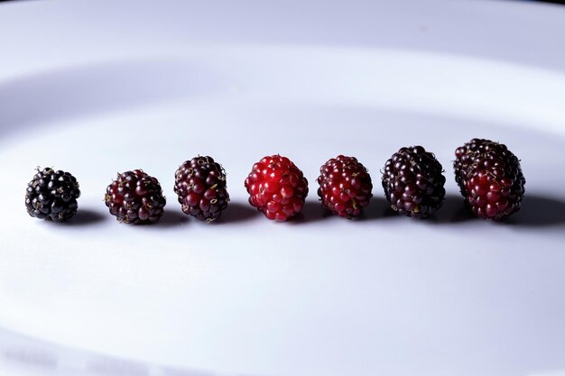 Close-up of strawberries on table against white background