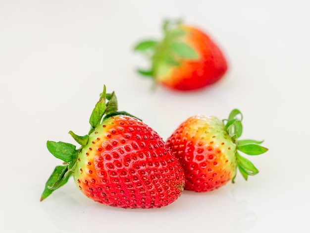 Close up of strawberries on the white background