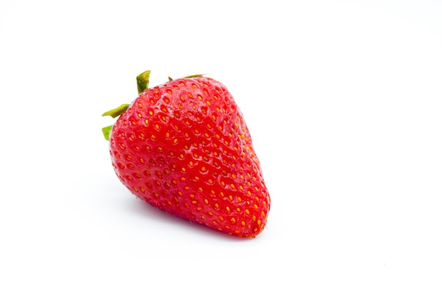 Photo close-up of strawberry against white background