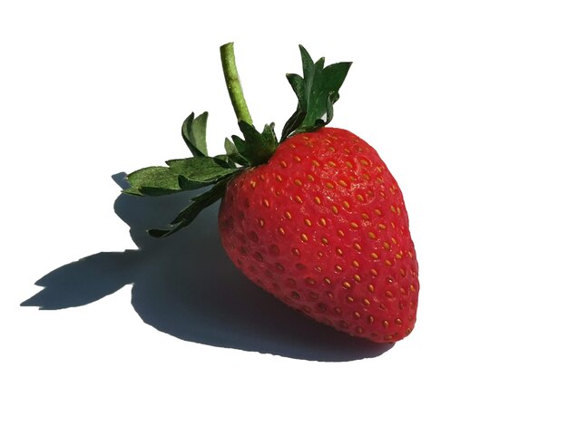 Close-up of strawberry against white background