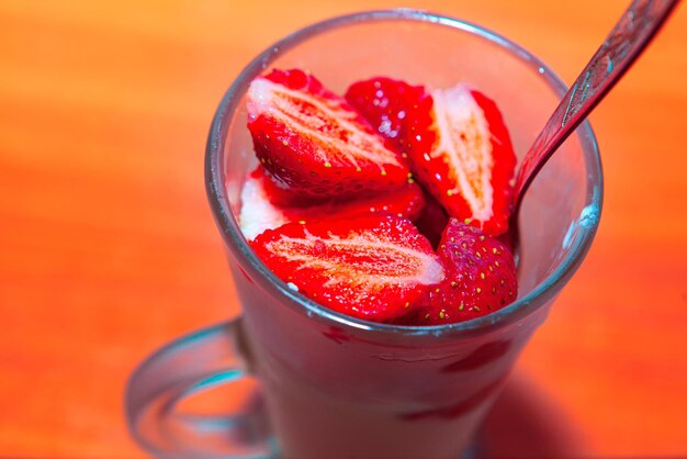 Close-up of strawberry in glass on table