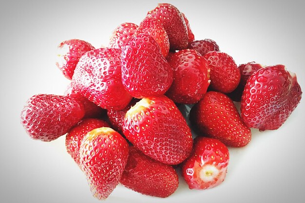 Close-up of strawberry over white background