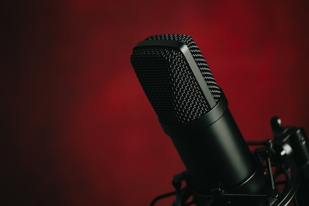 A close up of a streaming microphone over red