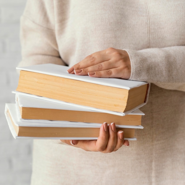 Close up student holding books