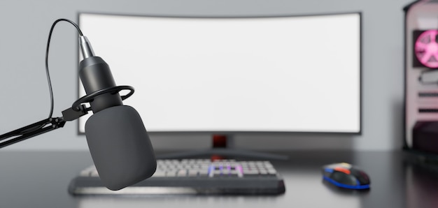 Photo close-up of studio microphone with desk and gaming computer out of focus behind