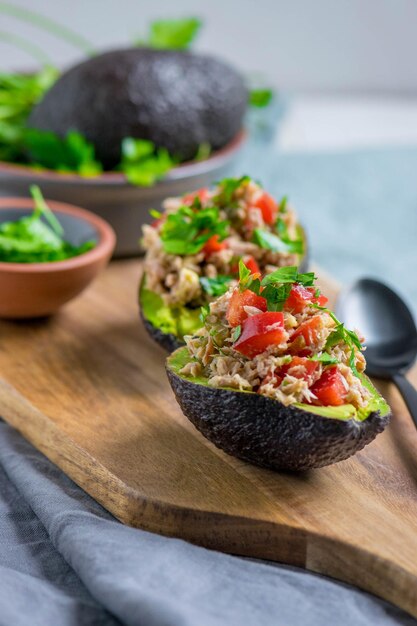 Close-up of stuffed avocado on cutting board