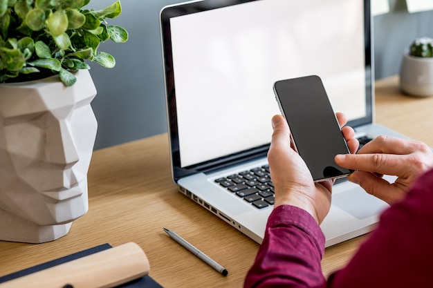 Photo close up of stylish composition with businessman mock up laptop screen and office supply template