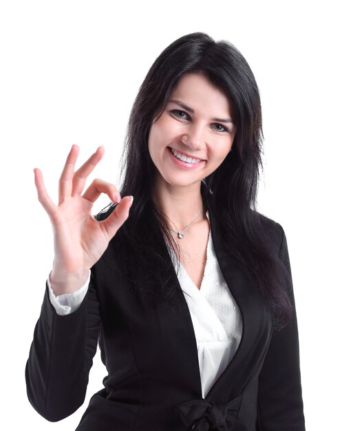 Close up.successful business woman showing OK gesture