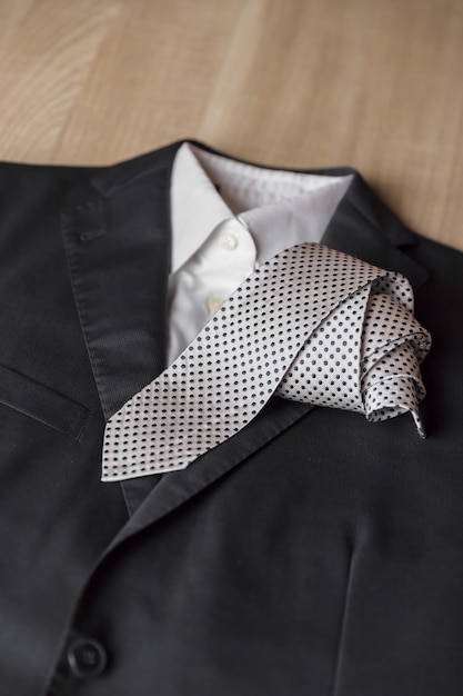 Close-up of suit and tie on table