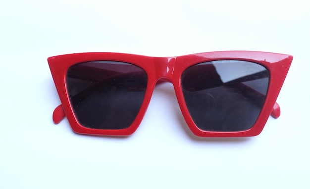 Photo close-up of sunglasses over white background