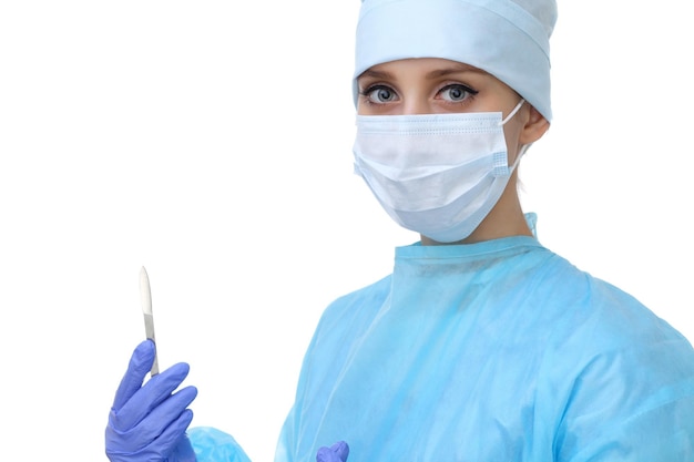 Close up of surgeon woman looking at camera, isolated. Surgery and medicine concept