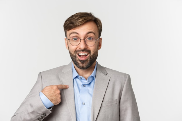 Close up of surprised and excited office worker in glasses and gray suit