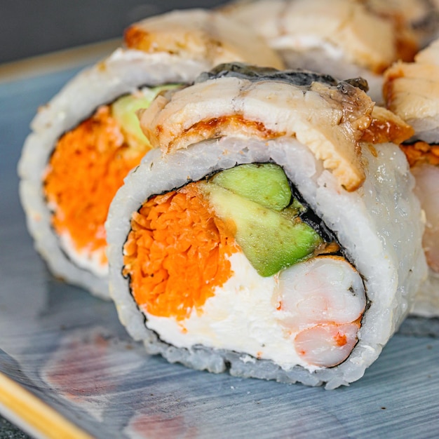 Close up of a sushi roll on a plate