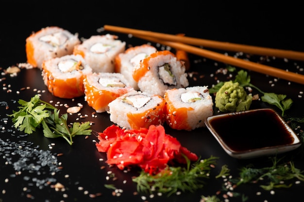 Close up of sushi rolls on black tray