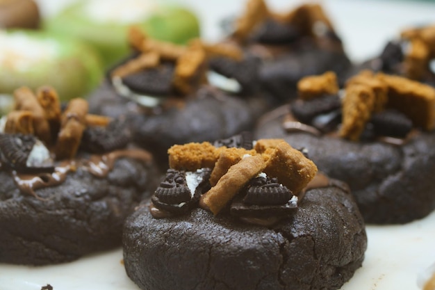 Close up of sweet chocolate cookies on wooden table