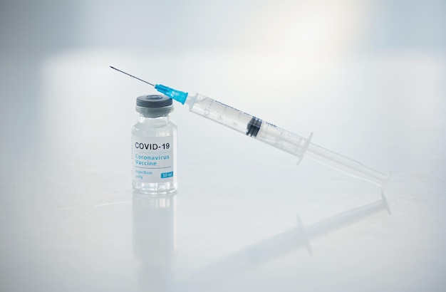 Close-up of syringe on table