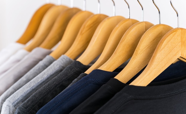 Close up of T-shirts on hangers