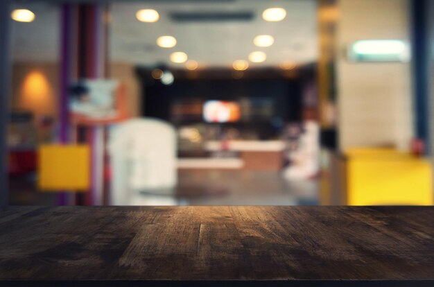 Close-up of table against illuminated defocused lights in restaurant