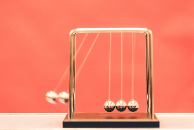 Close-up of table against red background