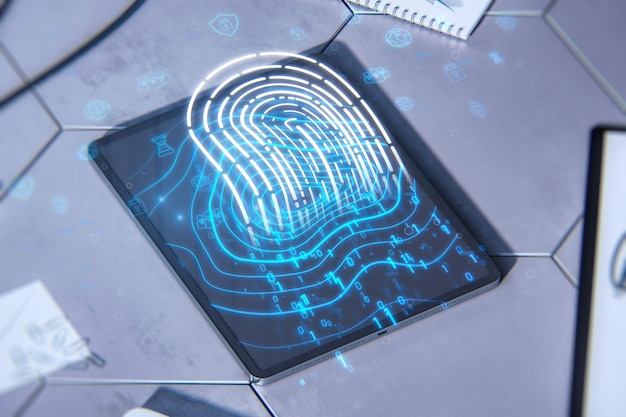 Close up of tablet on desktop with supplies and glowing digital\
fingerprint hologram digital id safety and authentication concept\
double exposure