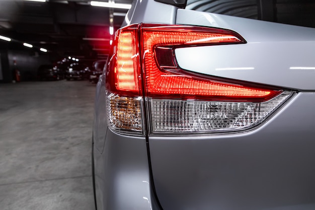 Close-up taillight of a new halogen silver crossover car. Exterior of a modern car