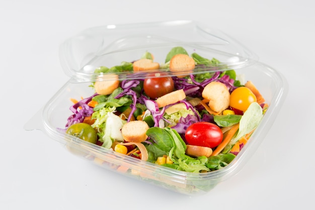 Close up of take away bowl with fast food salad