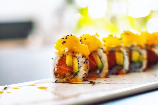 Close up of tasty japanese uramaki sushi with salmon