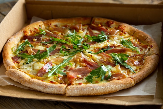 Close-up of tasty pizza  with ham and vegetables