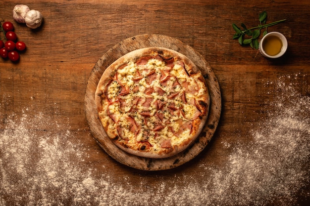 Close-up of tasty pizza on a wooden cutting board