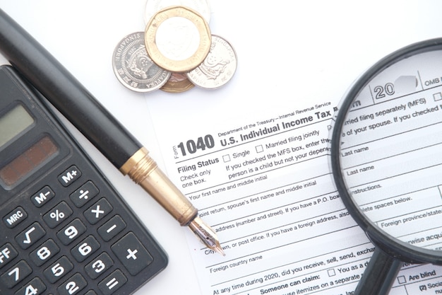 Close up of a tax return form and pen on table