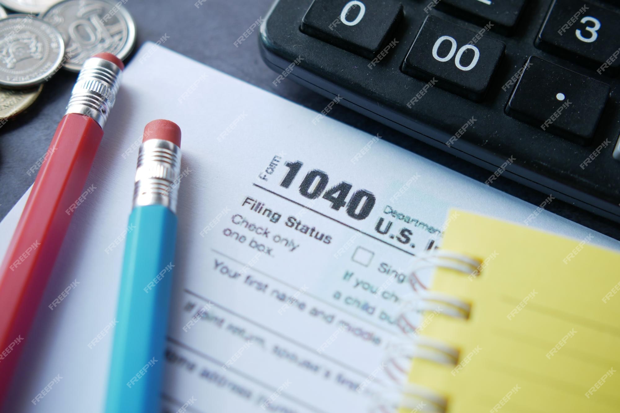 Premium Photo  Pen and coins on the tax form