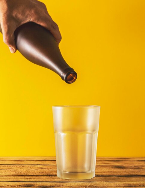 Close-up of tea cup on table against yellow background