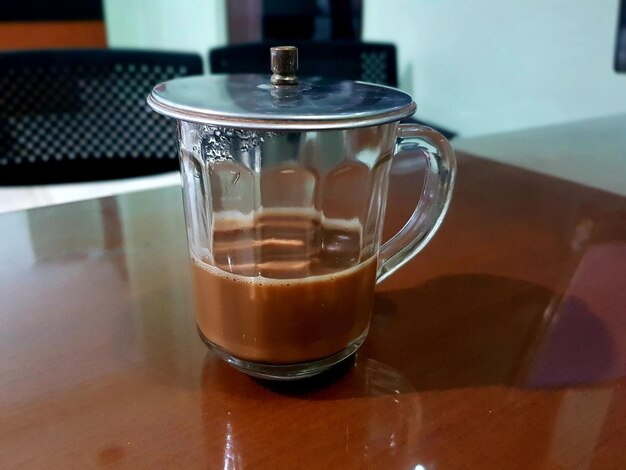 Photo close-up of tea cup on table