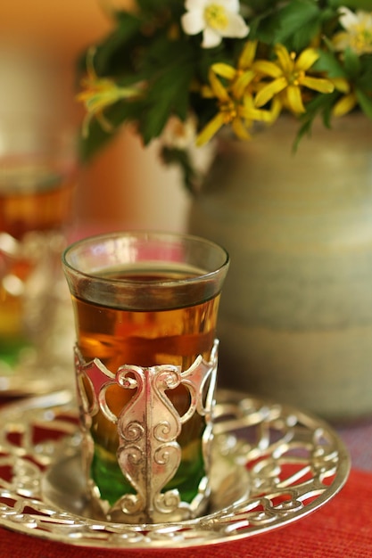 close-up of tea in glass on plate