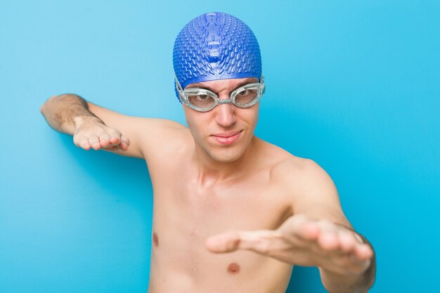 Close up of a teenager caucasian swimmer man