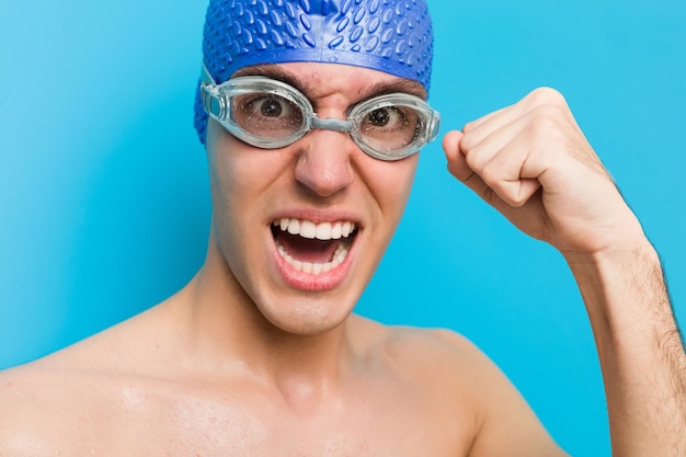 Close up of a teenager caucasian swimmer man