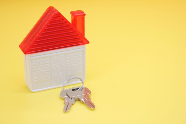 Close-up of telephone booth on table against yellow background