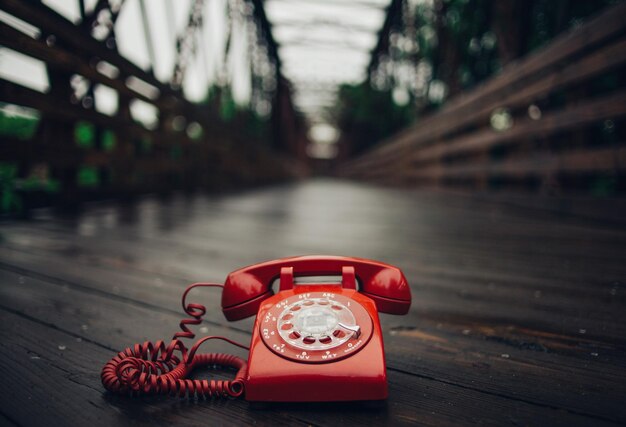 Close-up of telephone booth on table