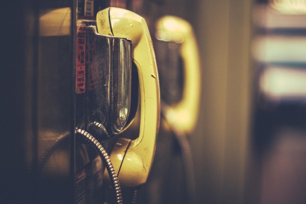 Photo close-up of telephone in booth