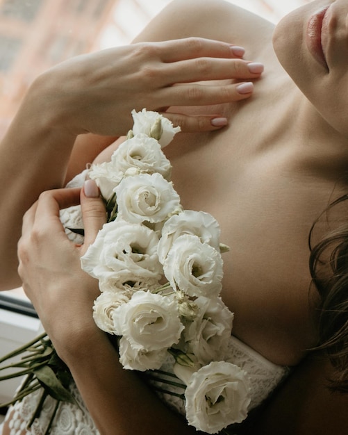 Close up of tender white flowers in womens hands