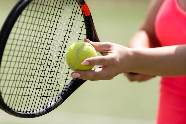 Close up of a tennis player hitting the ball with racket