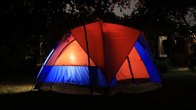 Photo close-up of tent against the sky at night