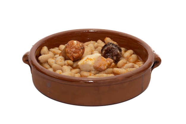 Close up of a terracotta dish with Asturian fabada a typical Spanish bean stew