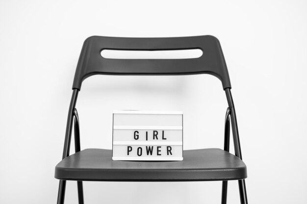 Close-up of text on chair against white background