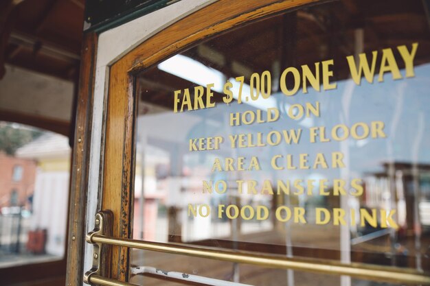 Photo close-up of text on glass door