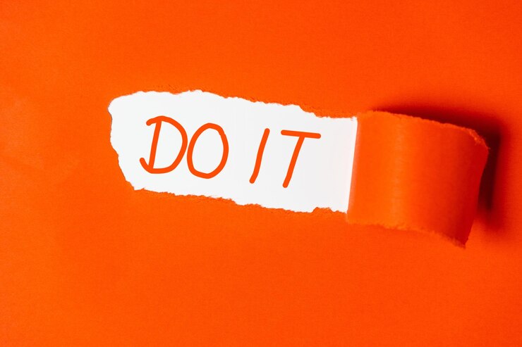 Photo close-up of text on orange wall
