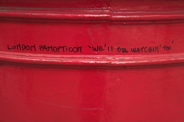 Close-up of text on red metal