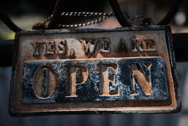 Photo close-up of text on rusty metal