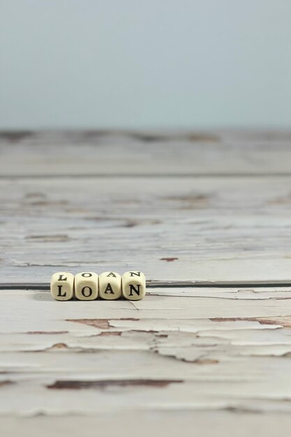 Photo close-up of text on table against sky